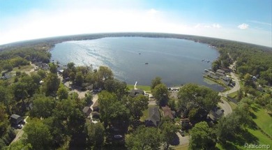 OUTSTANDING VIEWS from this all sports, Lake Nepessing lakefront on Lapeer Country Club in Michigan - for sale on GolfHomes.com, golf home, golf lot