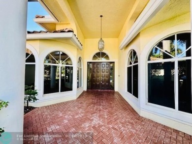 Allow yourself to be immersed in complete serenity and peace on Weston Hills Country Club in Florida - for sale on GolfHomes.com, golf home, golf lot