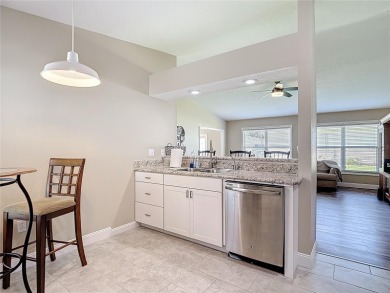 LIGHT, BRIGHT AND OPEN!! This spacious two bedroom + flex space on Tampa Bay Golf and Country Club in Florida - for sale on GolfHomes.com, golf home, golf lot