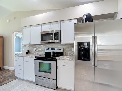 LIGHT, BRIGHT AND OPEN!! This spacious two bedroom + flex space on Tampa Bay Golf and Country Club in Florida - for sale on GolfHomes.com, golf home, golf lot