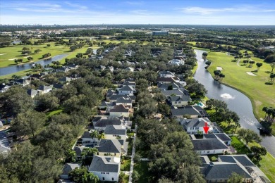 SWEEPING WATER AND GOLF VIEWS abound in this rarely available on Abacoa Golf Club in Florida - for sale on GolfHomes.com, golf home, golf lot