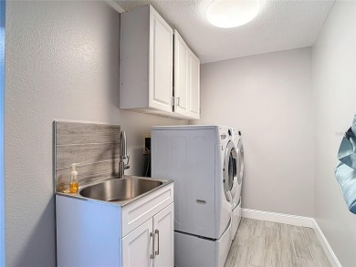 LIGHT, BRIGHT AND OPEN!! This spacious two bedroom + flex space on Tampa Bay Golf and Country Club in Florida - for sale on GolfHomes.com, golf home, golf lot