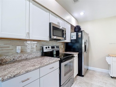 LIGHT, BRIGHT AND OPEN!! This spacious two bedroom + flex space on Tampa Bay Golf and Country Club in Florida - for sale on GolfHomes.com, golf home, golf lot