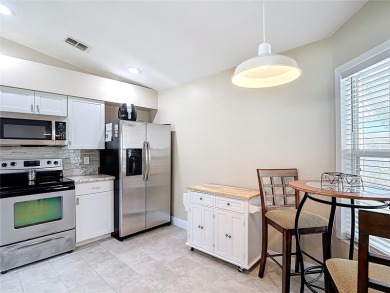 LIGHT, BRIGHT AND OPEN!! This spacious two bedroom + flex space on Tampa Bay Golf and Country Club in Florida - for sale on GolfHomes.com, golf home, golf lot