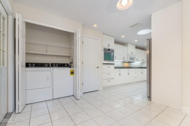 This end-unit villa condominium offers scenic golf course views on Spruce Creek Golf Club in Florida - for sale on GolfHomes.com, golf home, golf lot