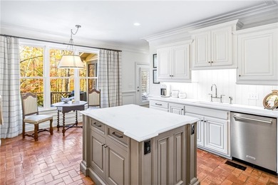 Tucked beneath a canopy of mature hardwoods and overlooking the on Moores Mill Golf Club in Alabama - for sale on GolfHomes.com, golf home, golf lot