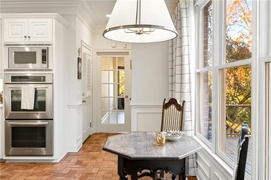 Tucked beneath a canopy of mature hardwoods and overlooking the on Moores Mill Golf Club in Alabama - for sale on GolfHomes.com, golf home, golf lot