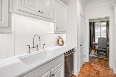 Tucked beneath a canopy of mature hardwoods and overlooking the on Moores Mill Golf Club in Alabama - for sale on GolfHomes.com, golf home, golf lot