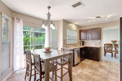 Welcome to this lovingly maintained 4-bedroom, 2.5-bath home on Hunters Green Country Club in Florida - for sale on GolfHomes.com, golf home, golf lot
