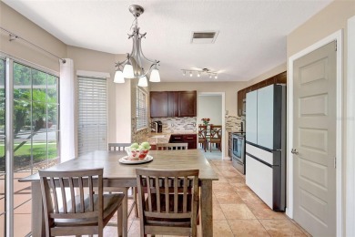 Welcome to this lovingly maintained 4-bedroom, 2.5-bath home on Hunters Green Country Club in Florida - for sale on GolfHomes.com, golf home, golf lot
