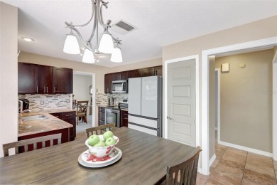 Welcome to this lovingly maintained 4-bedroom, 2.5-bath home on Hunters Green Country Club in Florida - for sale on GolfHomes.com, golf home, golf lot