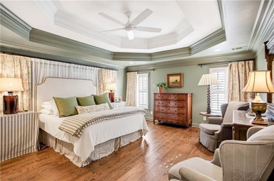 Tucked beneath a canopy of mature hardwoods and overlooking the on Moores Mill Golf Club in Alabama - for sale on GolfHomes.com, golf home, golf lot