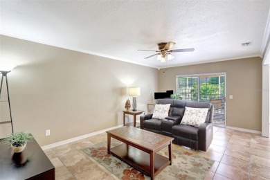 Welcome to this lovingly maintained 4-bedroom, 2.5-bath home on Hunters Green Country Club in Florida - for sale on GolfHomes.com, golf home, golf lot