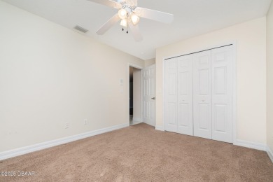 This end-unit villa condominium offers scenic golf course views on Spruce Creek Golf Club in Florida - for sale on GolfHomes.com, golf home, golf lot