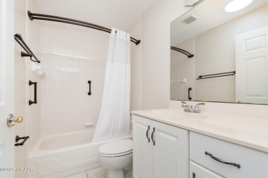 This end-unit villa condominium offers scenic golf course views on Spruce Creek Golf Club in Florida - for sale on GolfHomes.com, golf home, golf lot