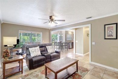 Welcome to this lovingly maintained 4-bedroom, 2.5-bath home on Hunters Green Country Club in Florida - for sale on GolfHomes.com, golf home, golf lot