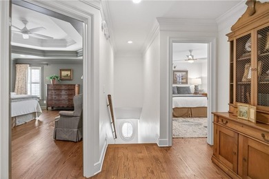 Tucked beneath a canopy of mature hardwoods and overlooking the on Moores Mill Golf Club in Alabama - for sale on GolfHomes.com, golf home, golf lot