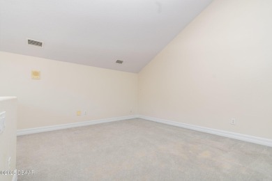 This end-unit villa condominium offers scenic golf course views on Spruce Creek Golf Club in Florida - for sale on GolfHomes.com, golf home, golf lot