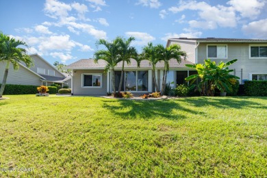 This end-unit villa condominium offers scenic golf course views on Spruce Creek Golf Club in Florida - for sale on GolfHomes.com, golf home, golf lot