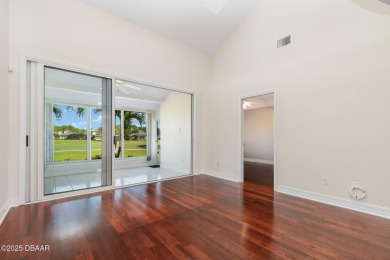 This end-unit villa condominium offers scenic golf course views on Spruce Creek Golf Club in Florida - for sale on GolfHomes.com, golf home, golf lot