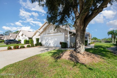 This end-unit villa condominium offers scenic golf course views on Spruce Creek Golf Club in Florida - for sale on GolfHomes.com, golf home, golf lot