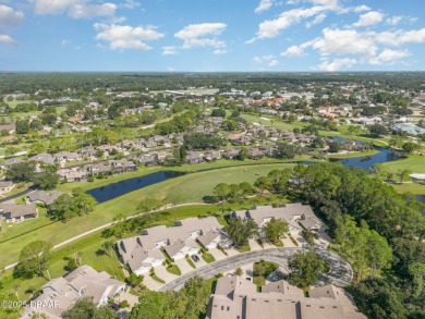 This end-unit villa condominium offers scenic golf course views on Spruce Creek Golf Club in Florida - for sale on GolfHomes.com, golf home, golf lot