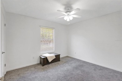 Welcome to this lovingly maintained 4-bedroom, 2.5-bath home on Hunters Green Country Club in Florida - for sale on GolfHomes.com, golf home, golf lot