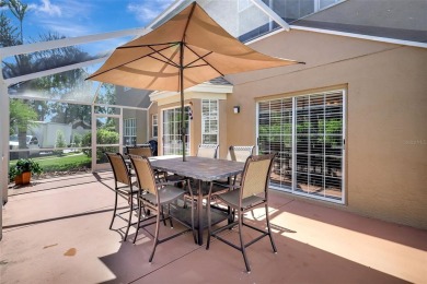 Welcome to this lovingly maintained 4-bedroom, 2.5-bath home on Hunters Green Country Club in Florida - for sale on GolfHomes.com, golf home, golf lot
