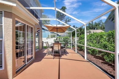 Welcome to this lovingly maintained 4-bedroom, 2.5-bath home on Hunters Green Country Club in Florida - for sale on GolfHomes.com, golf home, golf lot
