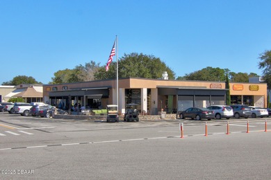 This end-unit villa condominium offers scenic golf course views on Spruce Creek Golf Club in Florida - for sale on GolfHomes.com, golf home, golf lot