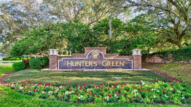 Welcome to this lovingly maintained 4-bedroom, 2.5-bath home on on Hunters Green Country Club in Florida - for sale on GolfHomes.com, golf home, golf lot