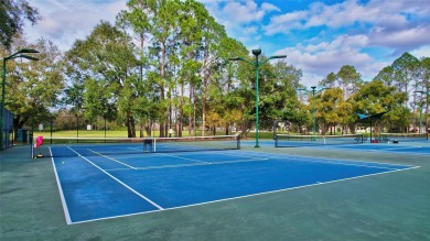 Welcome to this lovingly maintained 4-bedroom, 2.5-bath home on on Hunters Green Country Club in Florida - for sale on GolfHomes.com, golf home, golf lot