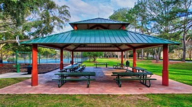 Welcome to this lovingly maintained 4-bedroom, 2.5-bath home on on Hunters Green Country Club in Florida - for sale on GolfHomes.com, golf home, golf lot