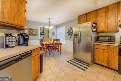 Welcome home to this beautiful 4-bedroom, 2.5-bath all-brick on Honey Creek Country Club in Georgia - for sale on GolfHomes.com, golf home, golf lot