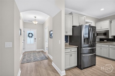 Welcome to this stunning coastal retreat in prestigious Savannah on Savannah Quarters Country Club in Georgia - for sale on GolfHomes.com, golf home, golf lot