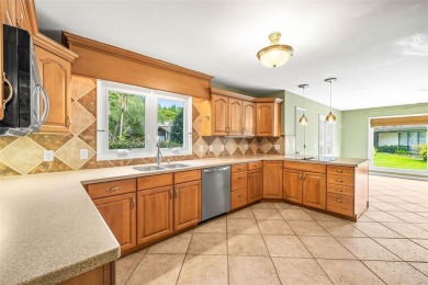 Welcome to 11804 Carrollwood Village Cove - Where Luxury Living on Emerald Greens Golf Resort and Country Club in Florida - for sale on GolfHomes.com, golf home, golf lot