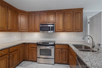 Premier Architecture and updates throughout this 3,500+ square on Gates Four Golf and Country Club in North Carolina - for sale on GolfHomes.com, golf home, golf lot