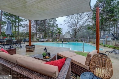 Welcome home to this beautiful 4-bedroom, 2.5-bath all-brick on Honey Creek Country Club in Georgia - for sale on GolfHomes.com, golf home, golf lot