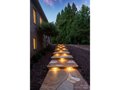 This spectacular 10,144 square foot waterfront home has a on Old North State Club at Uwharrie Point Golf community in North Carolina - for sale on GolfHomes.com, golf home, golf lot