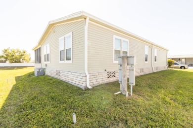 Welcome to your idyllic retreat at 1426 Whispering Pines Loop on Lily Lake Golf and RV Resort in Florida - for sale on GolfHomes.com, golf home, golf lot