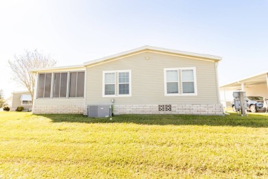 Welcome to your idyllic retreat at 1426 Whispering Pines Loop on Lily Lake Golf and RV Resort in Florida - for sale on GolfHomes.com, golf home, golf lot