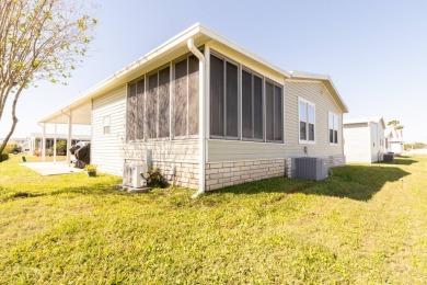 Welcome to your idyllic retreat at 1426 Whispering Pines Loop on Lily Lake Golf and RV Resort in Florida - for sale on GolfHomes.com, golf home, golf lot