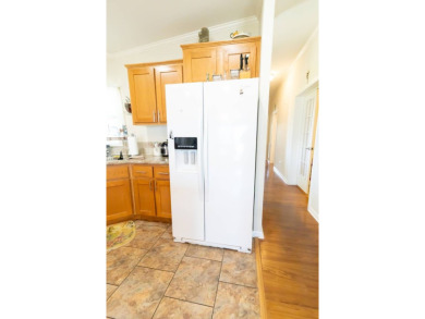 Welcome to your idyllic retreat at 1426 Whispering Pines Loop on Lily Lake Golf and RV Resort in Florida - for sale on GolfHomes.com, golf home, golf lot