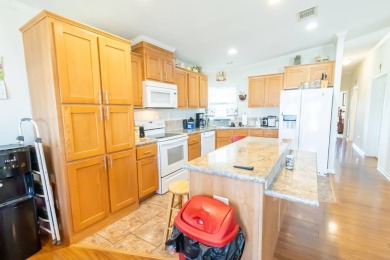 Welcome to your idyllic retreat at 1426 Whispering Pines Loop on Lily Lake Golf and RV Resort in Florida - for sale on GolfHomes.com, golf home, golf lot