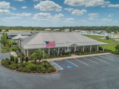 Welcome to your idyllic retreat at 1426 Whispering Pines Loop on Lily Lake Golf and RV Resort in Florida - for sale on GolfHomes.com, golf home, golf lot