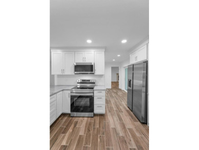 Under contract-accepting backup offers. Fully Renovated on Feather Sound Country Club in Florida - for sale on GolfHomes.com, golf home, golf lot