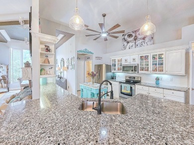 Welcome to this beautifully updated move-in ready pool home in on Plantation Bay Golf and Country Club in Florida - for sale on GolfHomes.com, golf home, golf lot
