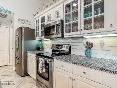 Welcome to this beautifully updated move-in ready pool home in on Plantation Bay Golf and Country Club in Florida - for sale on GolfHomes.com, golf home, golf lot