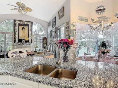 Welcome to this beautifully updated move-in ready pool home in on Plantation Bay Golf and Country Club in Florida - for sale on GolfHomes.com, golf home, golf lot