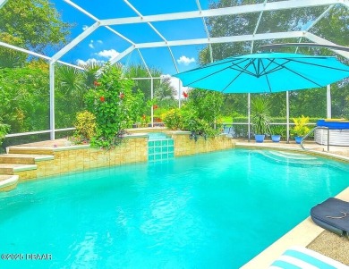 Welcome to this beautifully updated move-in ready pool home in on Plantation Bay Golf and Country Club in Florida - for sale on GolfHomes.com, golf home, golf lot
